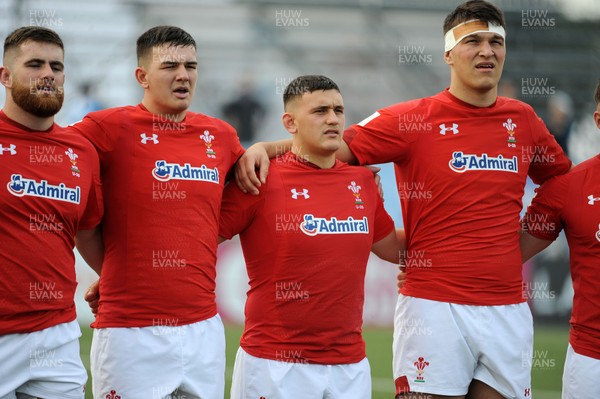 220619 - Wales U20 v England U20 - World Rugby Under 20 Championship - 5th Place Final -  (L to R) Kemsley Mathias, Tom Devine, Will Griffiths and Teddy Williams sing the national anthem