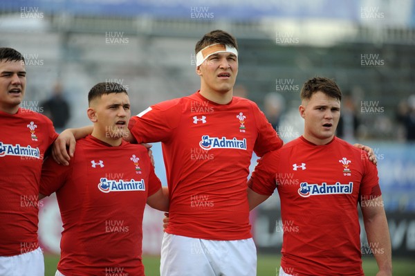 220619 - Wales U20 v England U20 - World Rugby Under 20 Championship - 5th Place Final -  (L to R) Tom Devine, Will Griffiths and Teddy Williams and Tom Hoppe sing the national anthem