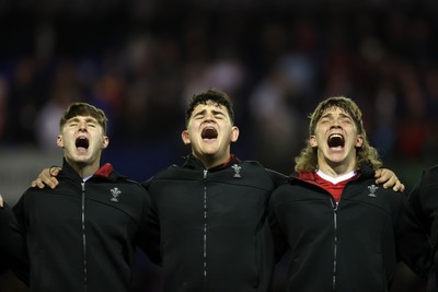 140325 - Wales U20s v England U20s - U20s Six Nations Championship - Steffan Emanuel, Sam Scott and Aidan Boshoff of Wales belt out the anthem