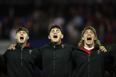 140325 - Wales U20s v England U20s - U20s Six Nations Championship - Steffan Emanuel, Sam Scott and Aidan Boshoff of Wales belt out the anthem