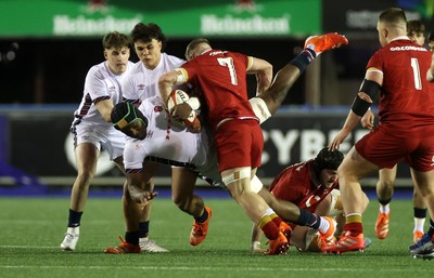 140325 - Wales U20s v England U20s - U20s Six Nations Championship - Junior Kpoku of England is tackled by Harry Beddall of Wales 