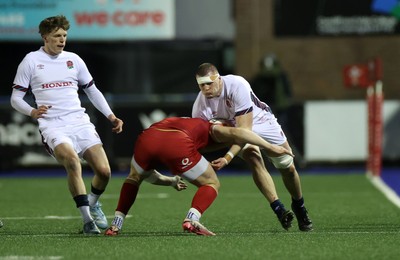 140325 - Wales U20s v England U20s - U20s Six Nations Championship - George Timmins of England is tackled by Harry Rees-Weldon of Wales 