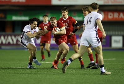 140325 - Wales U20s v England U20s - U20s Six Nations Championship - Harry Beddall of Wales is tackled by Josh Bellamy of England 