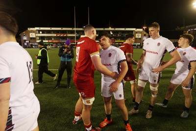 140325 - Wales U20s v England U20s - U20s Six Nations Championship - Luke Evans of Wales shakes hands with the opposition at full time