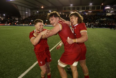 140325 - Wales U20s v England U20s - U20s Six Nations Championship - Tom Bowen, Deian Gwynne and Aidan Boshoff of Wales celebrate at full time