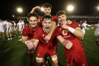 140325 - Wales U20s v England U20s - U20s Six Nations Championship - Deian Gwynne, Elis Price, Dan Gemine and Evan Wood of Wales celebrates at full time