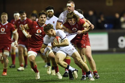 140325 - Wales U20 v England U20 - Six Nations Chamionship - Aidan Boshoff of Wales U20s is challenged by Nic Allison of England U20s