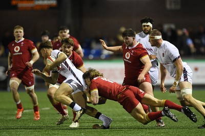 140325 - Wales U20 v England U20 - Six Nations Chamionship - Aidan Boshoff of Wales U20s is challenged by Nic Allison of England U20s