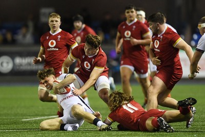 140325 - Wales U20 v England U20 - Six Nations Chamionship - Aidan Boshoff of Wales U20s is challenged by Nic Allison of England U20s