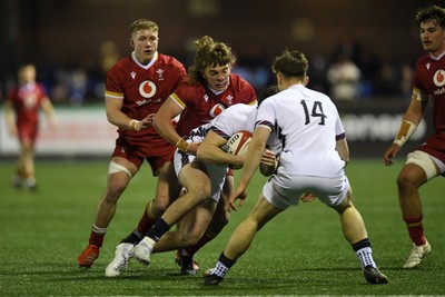 140325 - Wales U20 v England U20 - Six Nations Chamionship - Aidan Boshoff of Wales U20s is challenged by Jack Bracken of England U20s