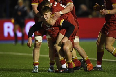 140325 - Wales U20 v England U20 - Six Nations Chamionship - Steffan Emanuel of Wales U20s celebrates scoring a try with team mates