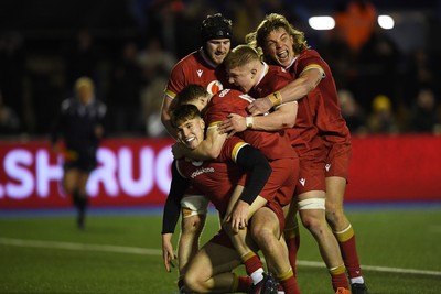 140325 - Wales U20 v England U20 - Six Nations Chamionship - Steffan Emanuel of Wales U20s celebrates scoring a try with team mates