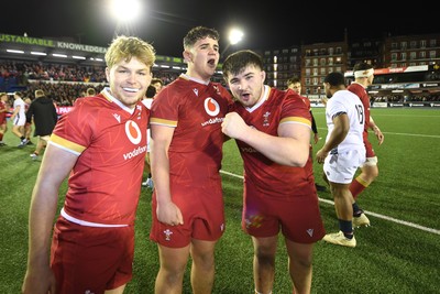 140325 - Wales U20 v England U20 - Six Nations Chamionship - Carwyn Edwards, Sam Scott and Harry Thomas of Wales U20s celebrates the win at full time