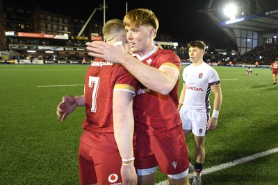 140325 - Wales U20 v England U20 - Six Nations Chamionship - Harry Beddall and Osian Roberts of Wales U20s celebrates the win at full time