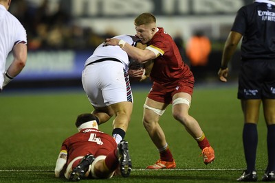 140325 - Wales U20 v England U20 - Six Nations Chamionship - Harry Beddall of Wales U20s is challenged by George Timmins of England U20s