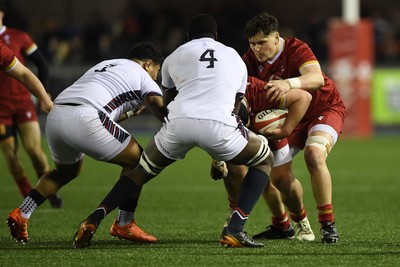 140325 - Wales U20 v England U20 - Six Nations Chamionship - Dan Gemine of Wales U20s is challenged by Olamide Sodeke of England U20s