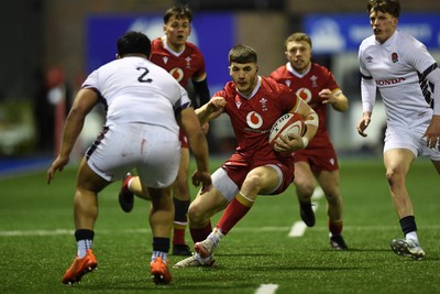 140325 - Wales U20 v England U20 - Six Nations Chamionship - Harry Rees-Weldon of Wales U20s is challenged by Kepu Tuipulotu of England U20s