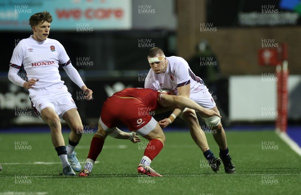 140325 - Wales U20s v England U20s - U20s Six Nations Championship - George Timmins of England is tackled by Harry Rees-Weldon of Wales 