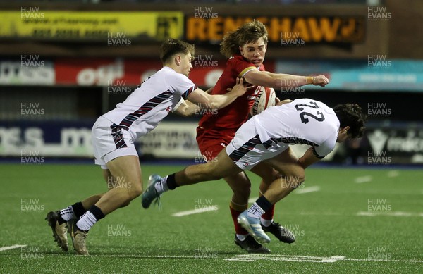 140325 - Wales U20s v England U20s - U20s Six Nations Championship - Aidan Boshoff of Wales is tackled by Jack Bracken and Josh Bellamy of England 