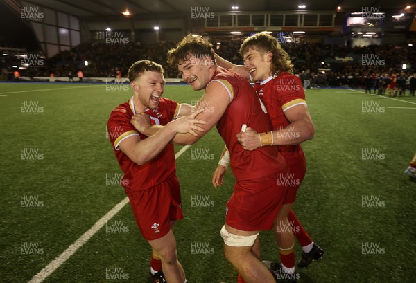 140325 - Wales U20s v England U20s - U20s Six Nations Championship - Tom Bowen, Deian Gwynne and Aidan Boshoff of Wales celebrate at full time