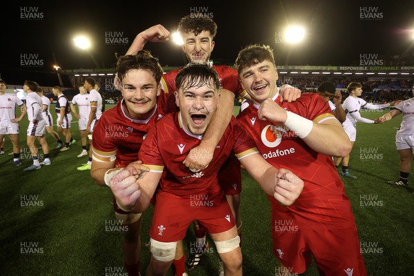 140325 - Wales U20s v England U20s - U20s Six Nations Championship - Deian Gwynne, Elis Price, Dan Gemine and Evan Wood of Wales celebrates at full time