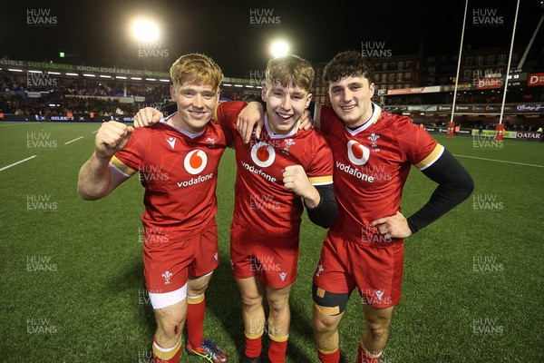 140325 - Wales U20s v England U20s - U20s Six Nations Championship - Osian Roberts, Steffan Emanuel and Harri Wilde of Wales celebrates at full time