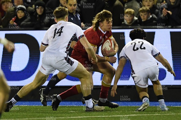 140325 - Wales U20 v England U20 - Six Nations Chamionship - Aidan Boshoff of Wales U20s is challenged by Josh Bellamy of England U20s