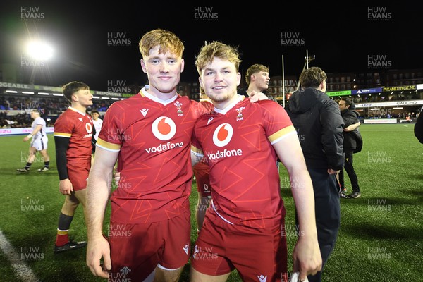 140325 - Wales U20 v England U20 - Six Nations Chamionship - Osian Roberts and Carwyn Edwards of Wales U20s celebrates the win at full time