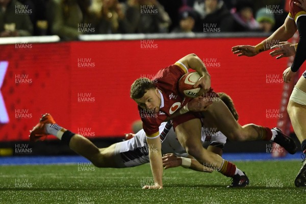 140325 - Wales U20 v England U20 - Six Nations Chamionship - Tom Bowen of Wales U20s is challenged by George Pearson of England U20s