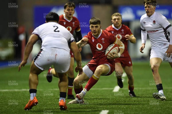 140325 - Wales U20 v England U20 - Six Nations Chamionship - Harry Rees-Weldon of Wales U20s is challenged by Kepu Tuipulotu of England U20s