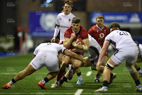 140325 - Wales U20 v England U20 - Six Nations Chamionship - Harry Rees-Weldon of Wales U20s is challenged by Kepu Tuipulotu of England U20s