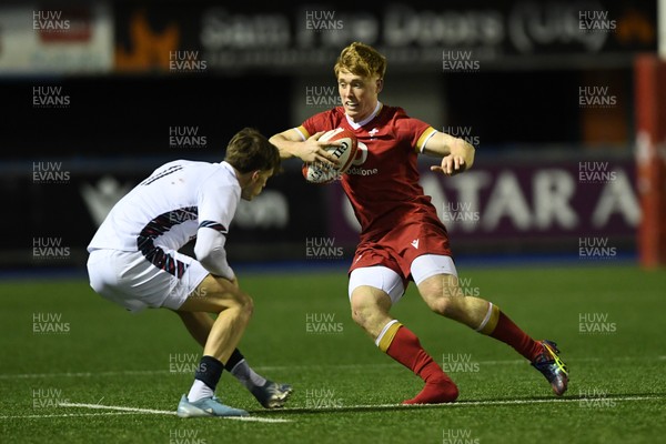 140325 - Wales U20 v England U20 - Six Nations Chamionship - Osian Roberts of Wales U20s is challenged by Jack Kinder of England U20s