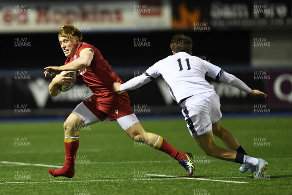 140325 - Wales U20 v England U20 - Six Nations Chamionship - Osian Roberts of Wales U20s is challenged by Jack Kinder of England U20s