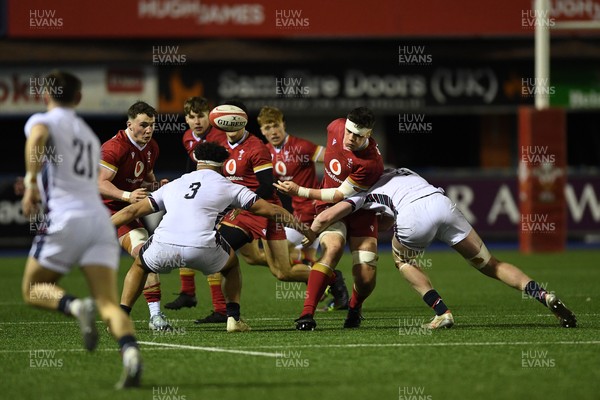 140325 - Wales U20 v England U20 - Six Nations Chamionship - Kenzie Jenkins of Wales U20s is challenged by Tye Raymont of England U20s