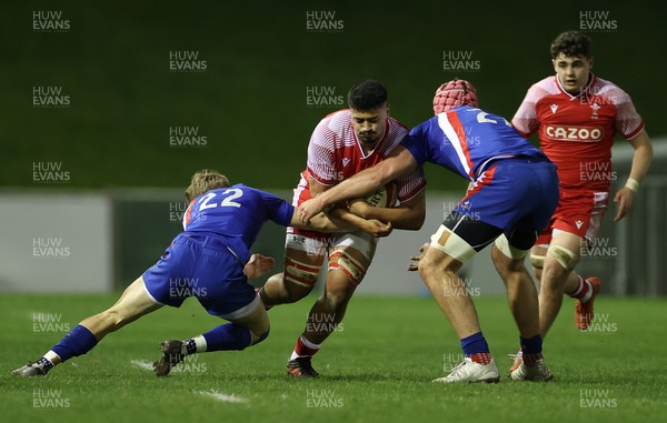 100322 - Wales U20s v France U20s - U20s 6 Nations Championship - Ben Moa of Wales is tackled by Simon Tarel and Clement Garrigues of France