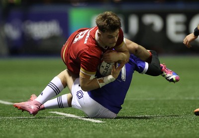 140226 - Wales U20s v France U20s - U20s Six Nations Championship - Deian Gwynne of Wales is tackled by Rates Melvyn of France 