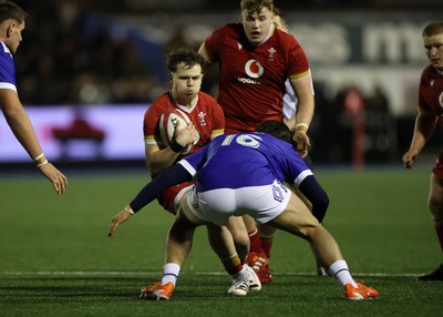 140226 - Wales U20s v France U20s - U20s Six Nations Championship - Carwyn Leggatt-Jones of Wales is tackled by Garault Gabin of France 