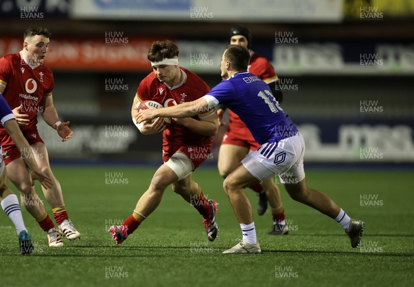 140226 - Wales U20s v France U20s - U20s Six Nations Championship - Deian Gwynne of Wales is tackled by Drault Adrien of France 