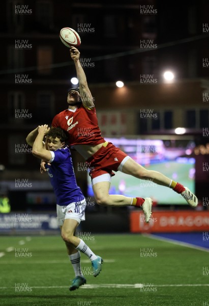 140226 - Wales U20s v France U20s - U20s Six Nations Championship - Rhys Cummings of Wales gets above Latrasse Antoine of France for the ball