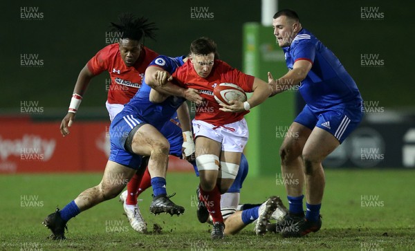 160318 - Wales U20s v France U20s - Natwest 6 Nations Championship - Taine Basham of Wales is tackled by Guillaume Marchand of France