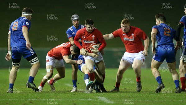 160318 - Wales U20s v France U20s - Natwest 6 Nations Championship - Tommy Rogers of Wales is tackled by Jules Gimbert of France
