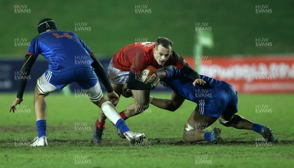 160318 - Wales U20s v France U20s - Natwest 6 Nations Championship - Ioan Nicholas of Wales is tackled by Camero Woki of France