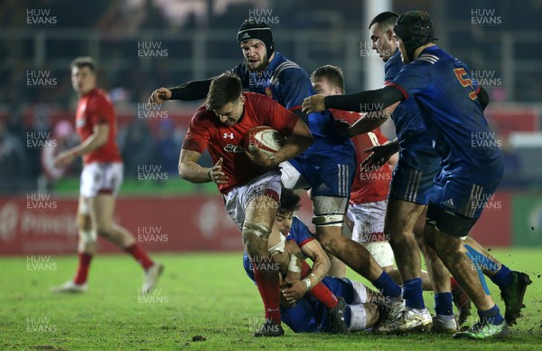 160318 - Wales U20s v France U20s - Natwest 6 Nations Championship - Taine Basham of Wales is tackled by Romain Ntamack of France