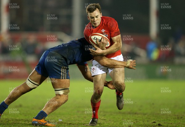 160318 - Wales U20s v France U20s - Natwest 6 Nations Championship - Cai Evans of Wales is tackled by Sacha Zegueur of France