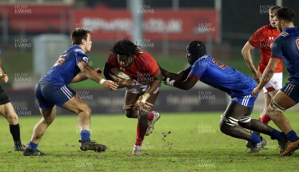 160318 - Wales U20s v France U20s - Natwest 6 Nations Championship - Max Williams of Wales is tackled by Lucas Peyresblanques and Ibrahim Diallo of France