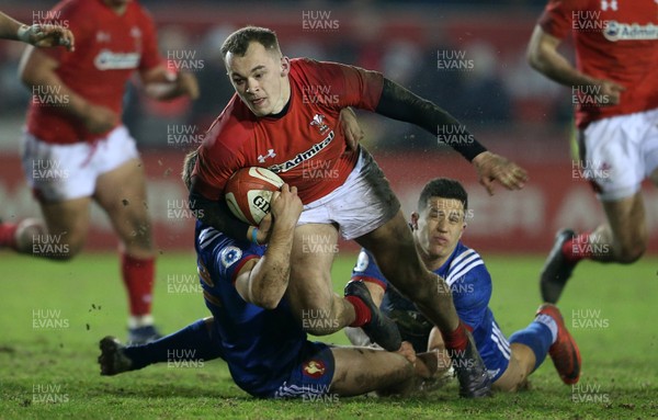 160318 - Wales U20s v France U20s - Natwest 6 Nations Championship - Ioan Nicholas of Wales is tackled by Louis Carbonel and Adrien Seguret of France