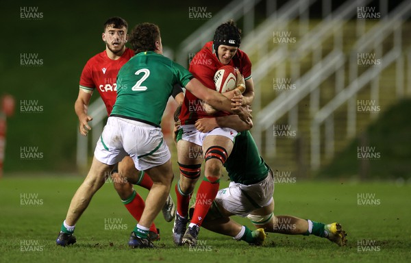 030223 - Wales U20s v Ireland U20s - U20s 6 Nations Championship - Owain Evans of Wales is tackled by Gus McCarthy of Ireland 
