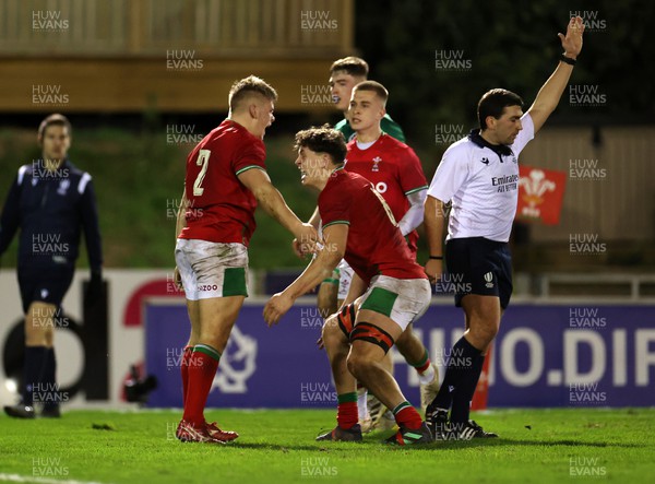 030223 - Wales U20s v Ireland U20s - U20s 6 Nations Championship - Sam Scarfe of Wales celebrates scoring a try with Ryan Woodman