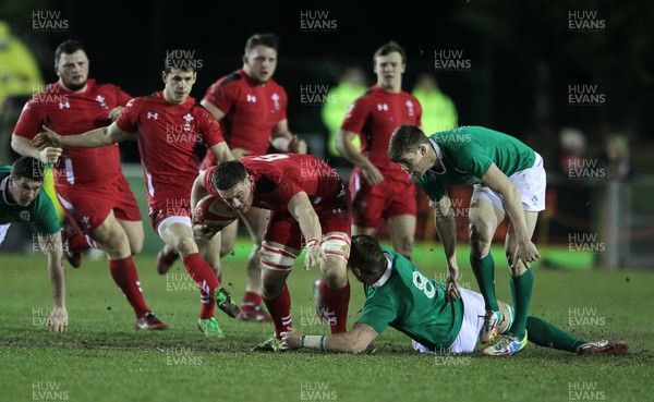 130315 - Wales U20s v Ireland U20s - RBS 6 Nations - Harrison Keddie of Wales is tackled by Lorcan Dow of Ireland