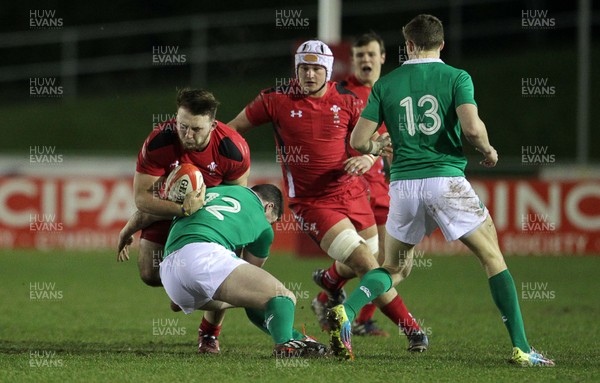 130315 - Wales U20s v Ireland U20s - RBS 6 Nations - Dillon Lewis of Wales is tackled by Sam Arnold of Ireland